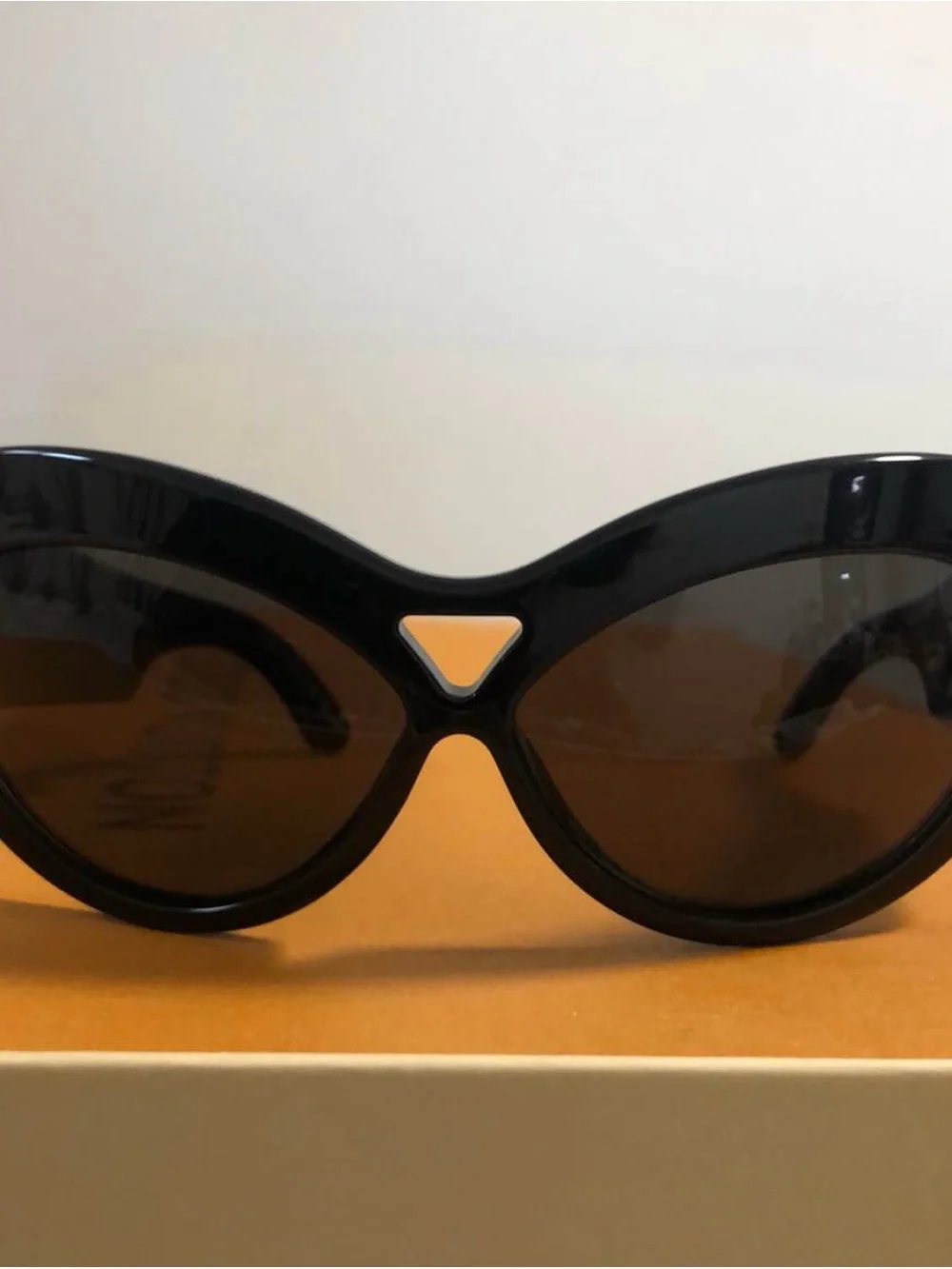 Yves Saint Laurent Black Women's Oval Sunglasses with Dark Lenses